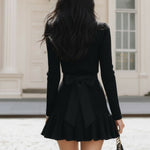 Elegant Black Ribbed Knitted Mini Skirt With Gold Buckle Ruffle Hem
